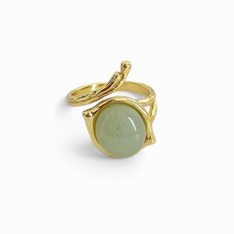 Sculptural etched gold wrap ring with circular green stone — Bye Bye Baby