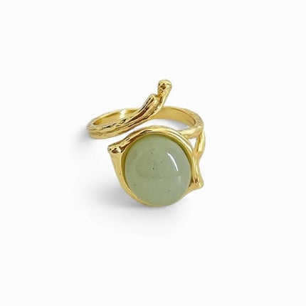 Sculptural etched gold wrap ring with circular green stone — Bye Bye Baby