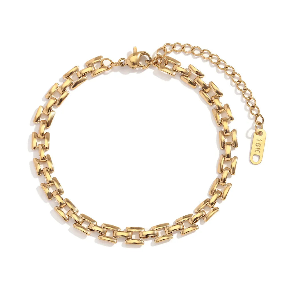 Gold chain bracelet on a white background