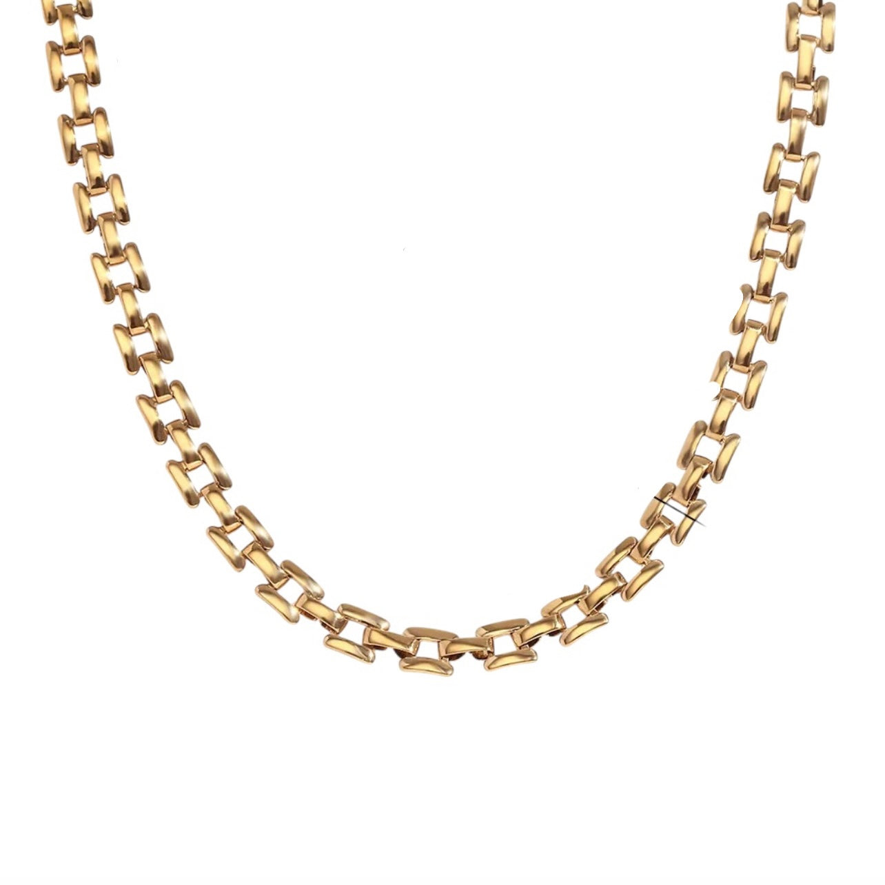 Gold chain necklace on a white background