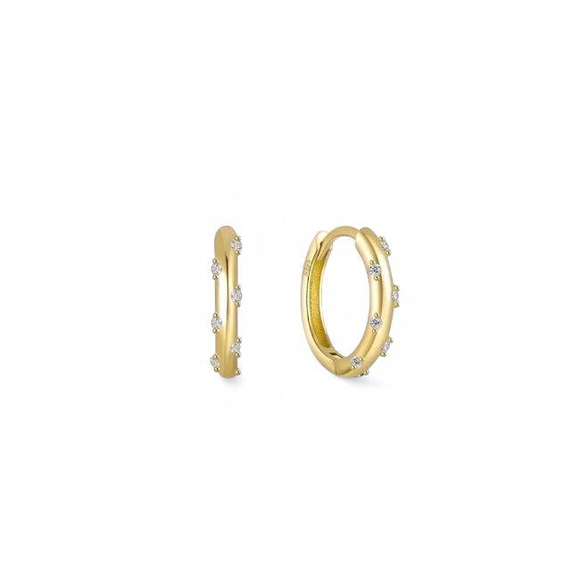 Gold plated zirconia huggie earrings close to ear — Bye Bye Baby