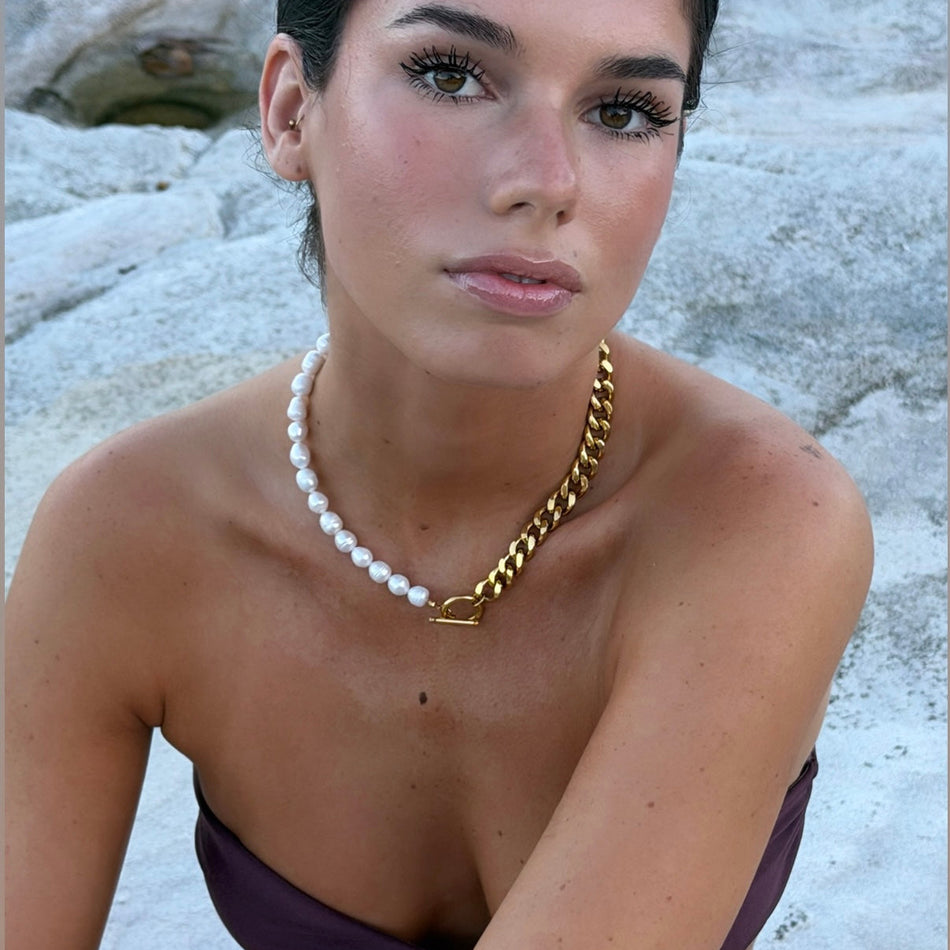 18k gold freshwater pearl necklace on collarbone — Bye Bye Baby