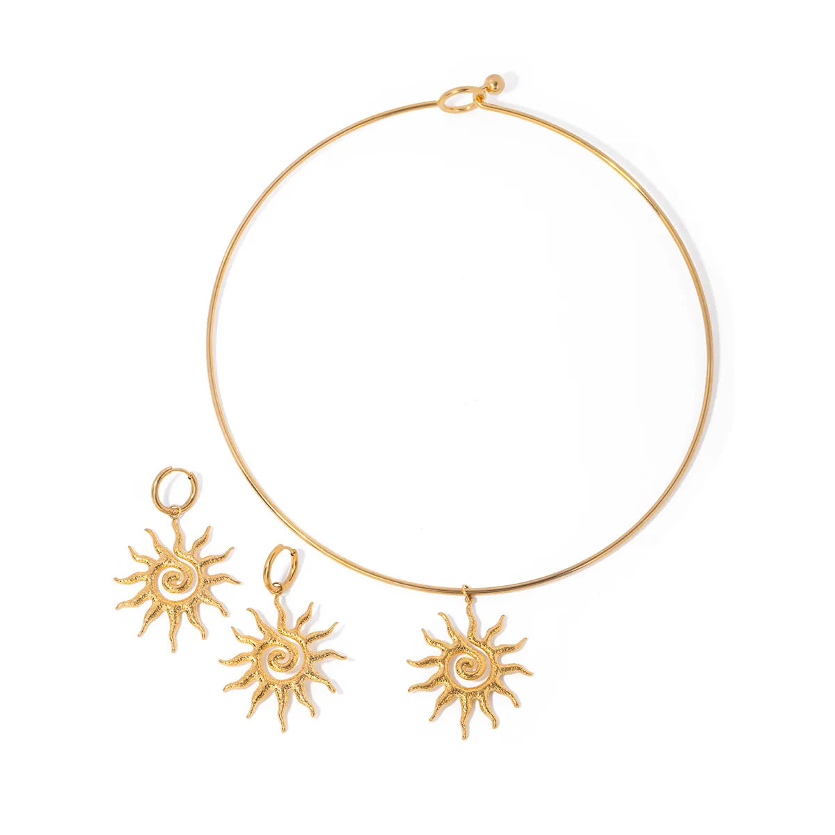Gold necklace with sun-shaped pendants on a white background